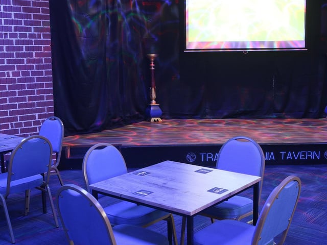 There is a stage area for energetic customers who may enjoy performing karaoke classics. The space is also ideal for live music and any type of entertainment to keep guests entertained.