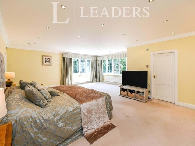 The master bedroom is quite a size, with windows overlooking the back of the property. There is access to an en suite bathroom and also a dressing room.