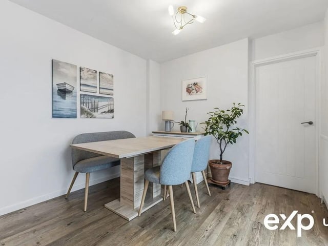 The dining area has more than enough space for a table and chairs, and there is a radiator along with an opening to the conservatory, making this a pleasant place to dine and entertain.