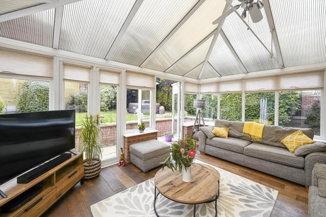 The Mansfield house is considerably enhanced by this large conservatory at the back. Bright and comfortable, it leads out to the garden, and with its dual double doors, it operates as an extended living area for the family.