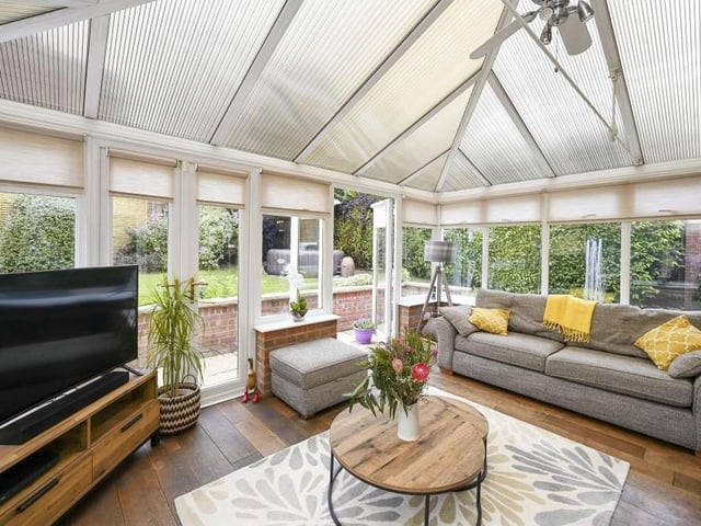The Mansfield house is considerably enhanced by this large conservatory at the back. Bright and comfortable, it leads out to the garden, and with its dual double doors, it operates as an extended living area for the family.
