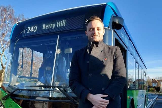 Coun Ben Bradley with a bus.
