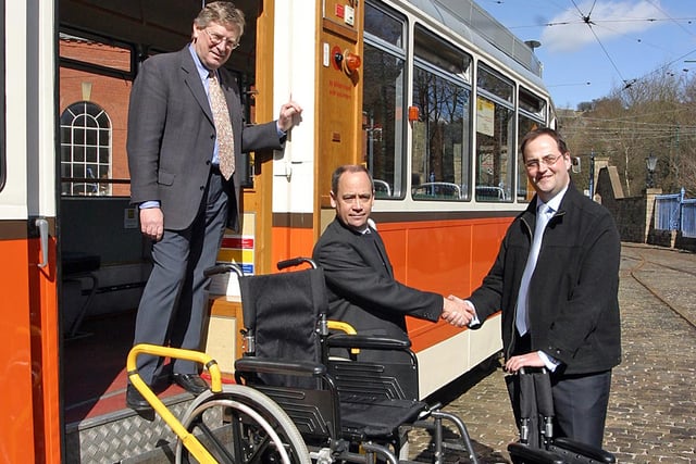 James Barnfield from Keep Able hands over the wheelchairs to Crich Tramway Museum Society Vice-Chairman Bob Pennyfather, back Andrew Braddock advisor heritage railway assiciation back in 2006
