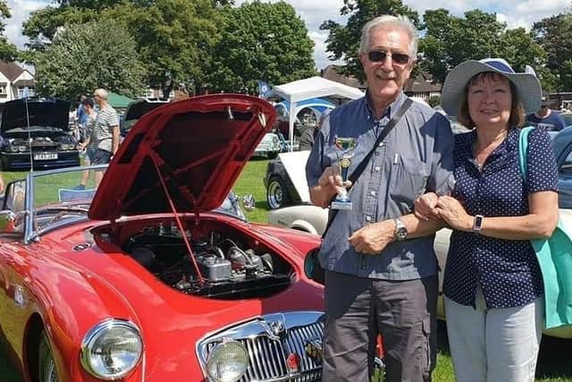 Retired Mansfield engineer Pete Draycott, pictured with wife Sandra and one of his own classic cars, is the chief organiser of the Berry Hill Park show.