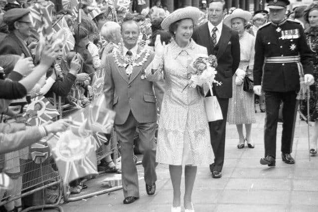 Coun George Jelley walks alongside the Queen as she waves to the Mansfield crowds in 1977. He was the father of Chris Cooper's auntie, Valerie Devney, who lives in Mansfield Woodhouse.