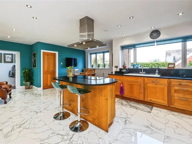 Breathtaking and finished to an exceptional standard with no expense spared, this extended two-bedroom (originally three) detached bungalow is located on the highly sought-after Chapel Lane in Ravenshead. The accommodation briefly comprises a welcoming entrance porch, a spacious living room, a charming four-piece family bathroom, and two generous double bedrooms, with the principal bedroom benefiting from a stylish en-suite and dressing area. The undoubted focal point of this stunning home is the open-plan kitchen/living/dining area, which boasts high-quality fitted appliances, a feature island, and access to a separate utility room, creating an ideal space for both everyday living and entertaining.