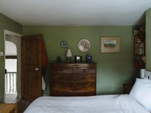 The main bedroom from a different angle, showing its entrance from the landing. As you can see, there is plenty of storage space.