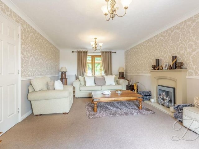The lounge, with its carpeted floor, offers warmth and comfort. There is also access, at one end, to the conservatory.
