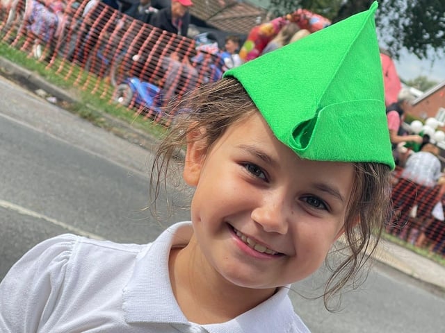 This youngster was excited to see the cyclists.