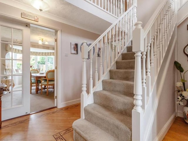 As we prepare to take a look at the bedrooms, let's return to the entrance hall and its lovely staircase. The room has Karndean flooring and coving to the ceiling.