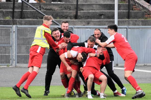 AFC players celebrate the winner against Hanley Town in the FA Vase.