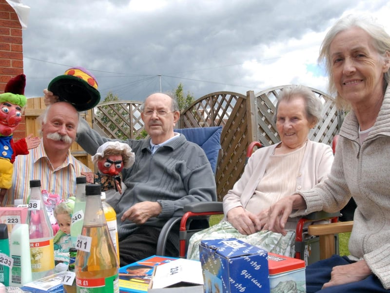 Residents of The Grange in Shirebrook enjoyed their summer fair. Pictured, Davido the clown with residents, Jim Widdowson, Dorothy West and Anne Piper serving at their stall.