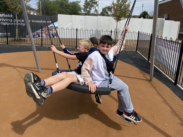 Children try out the new play area
