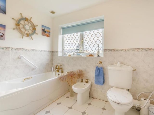 The last room to inspect in the Forest Town bungalow is the family bathroom. Its five-piece suite comprises a fitted bath, walk-in shower cubicle, low-flush WC, hand wash basin with storage and even a bidet.