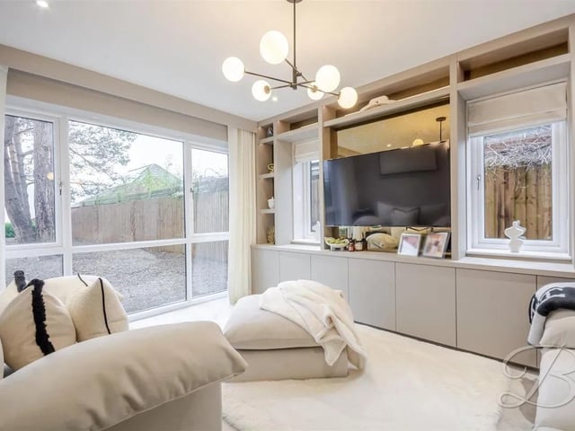 A bright, contemporary living space enhanced by floor-to-ceiling glazing and expansive side windows that draw in an abundance of natural light.