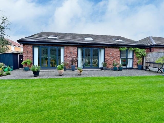 This is how the Bransdale Heights bungalow looks from the rear. You can see the large patio doors that lead from both the lounge and the kitchen diner out to the garden.