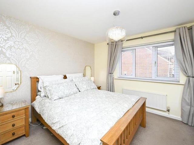 Moving up to the first floor now, and here is the master bedroom, which faces the back of the property. It features a dressing area and an en suite.