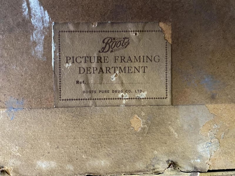 The back of the frame has a Boots sticker on it