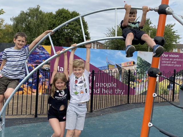 Children try out the new play area