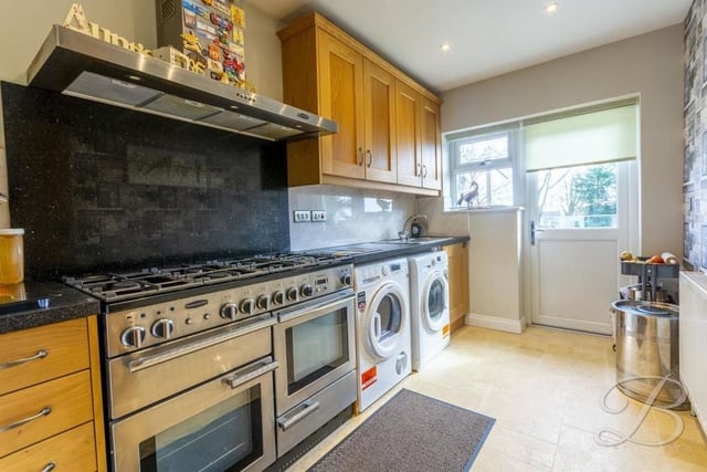 Just off the kitchen is this impressive utility room, which has space for a Rangemaster dual-fuel oven, a washing machine and tumble dryer. The room comes complete with a range of wall and base units, plus work surface over and inset sink and drainer.
