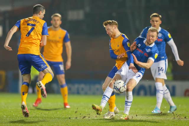 Mansfield Town midfielder Stephen Quinn battles with Rochdale midfielder Stephen Dooley. Photos by Chris Holloway/The Bigger Picture.media