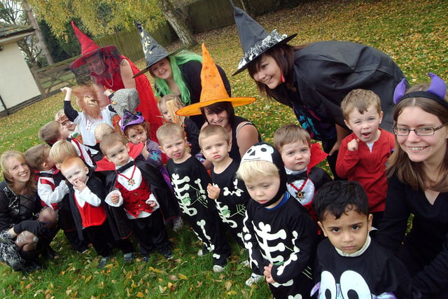 2009: children and their carers pose in their costumes during a Hallowe’en party at Hucknall Day Nursery.