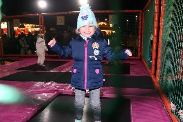 Adalind Hannant leaps for joy as she enjoys the trampolines during the 2019 festivities