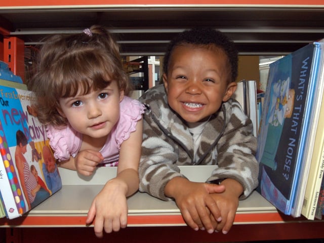 Kady-May Colbourne, 2, and Reuben Haines, 2, start off the Book Crawl at Mansfield Woodhouse Library today. Children had the opportunity to meet the Bookstart Bear and to join in a singing session. 2007.