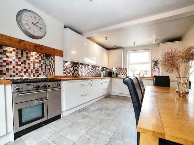 The dining kitchen is a good size, with a range of high-level and low-level cupboards and drawers, worktops and a free-standing Rangecooker. Integrated appliances include a fridge freezer and dishwasher.