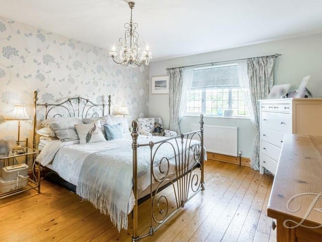 The master bedroom, which overlooks the front of the house, has a distinct touch of class about it. Assets include wood flooring, a fitted wardrobe, space for other furniture and access to an en suite shower room.