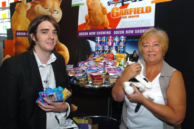 Pictured at the Odeon Cinema, Arundel Gate,  Sheffield in 2004, where Colin Oakley the marketing co-ordinator presented cat food to  Sheffield Hallam Cats Protection. Seen receiving the food is Janice Martin from  the Cats protection group, and cat Bella a 12 week old cat that is looking for a good home