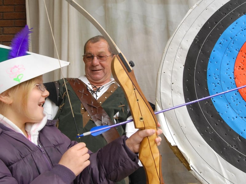 Natalie Bexon at a special archery workshop held at the Four Seasons shopping centre  with coach Len Worrell of Simply Archery in 2010.