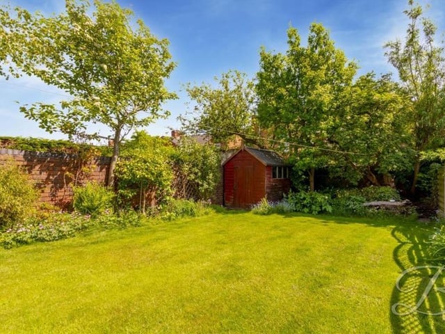 The back garden, which lends itself to relaxation or play. You choose.