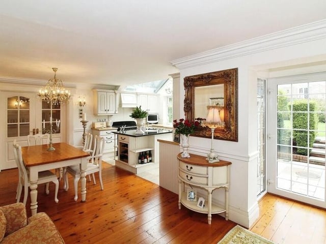 A second glance at the delightful dining room, with French doors to the right that lead to a patio.