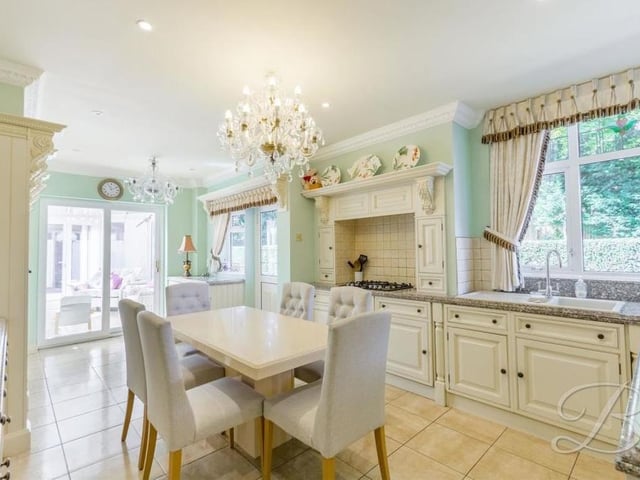 Moving on now to the stunning kitchen, which comes with a range of stylish cabinets and units, with complementary granite worktop over, inset sink and drainer. There is an integrated oven, microwave and five-ring gas hob with extractor fan, and space for all other essential appliances, plus a dining table. Underfloor heating, tiled flooring and downlights add to its appeal.