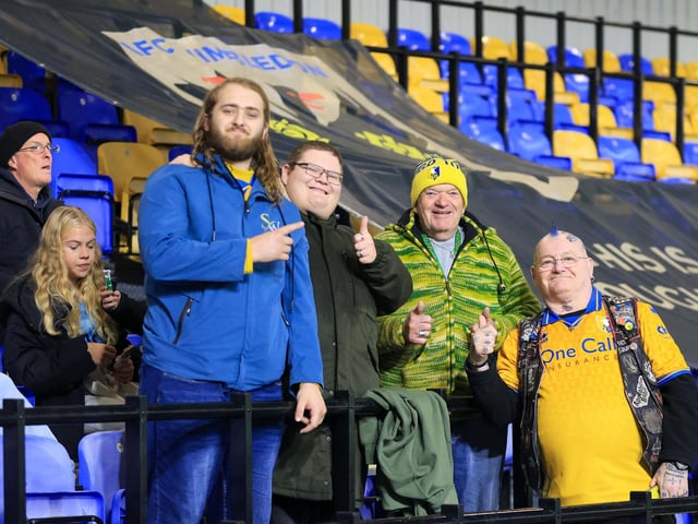 Travelling Mansfield Town fans during the Sky Bet League One match against AFC Wimbledon at Stadium Plough Lane.
