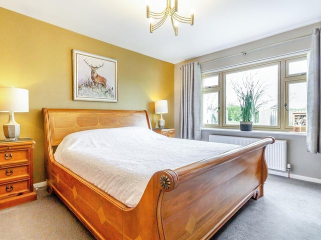 Both bedrooms at the Cauldwell Lane property are good-sized doubles, including this one, which is beautifully presented. The double-glazed window overlooks the front of the bungalow.