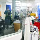 Medical staff wearing full PPE (personal protective equipment), including a face mask, long aprons, and gloves as a precautionary measure against COVID-19, work on an Intensive Care Unit (ICU) ward treating patients with COVID-19, at Frimley Park Hospital in Frimley, southwest England on May 22, 2020. - Britain's number of deaths "involving" the coronavirus has risen to 46,000, substantially higher than the 36,914 fatalities officially reported so far, according to a statistical update released Tuesday. (Photo by Steve Parsons / POOL / AFP) (Photo by STEVE PARSONS/POOL/AFP via Getty Images)
