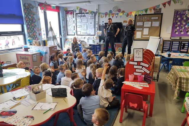 Officers talk to children at Leamington Primary School.