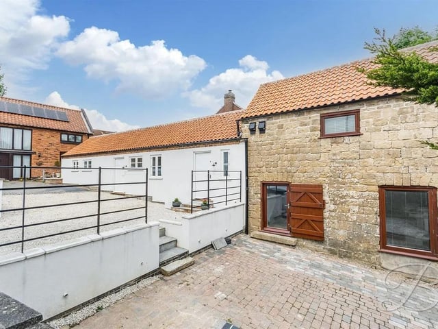 The self contained annex has two bedrooms and two bathrooms.