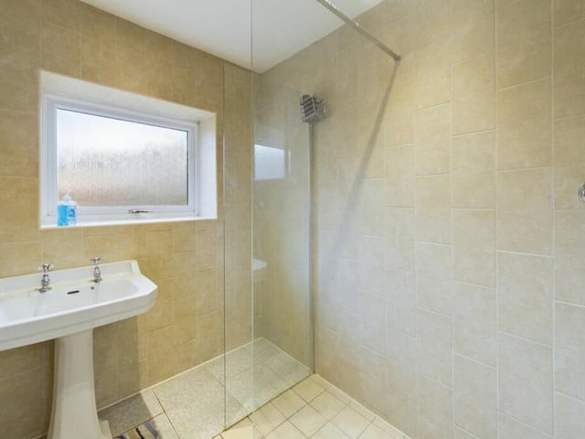 This compact but functional shower room can be found downstairs at Half Moon Farm.
