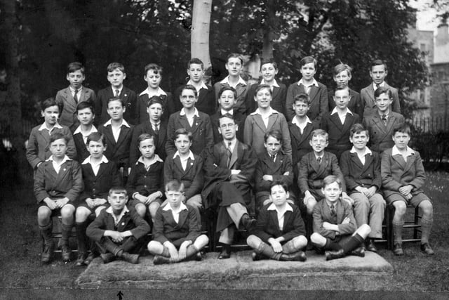 Smartly dressed boys and their teacher from the class of 1929-30 headed outdoors for this picture at Nether Edge Grammar School
