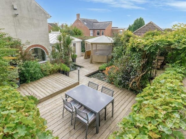 An overview of the decked seating area in the garden at Church Hill.