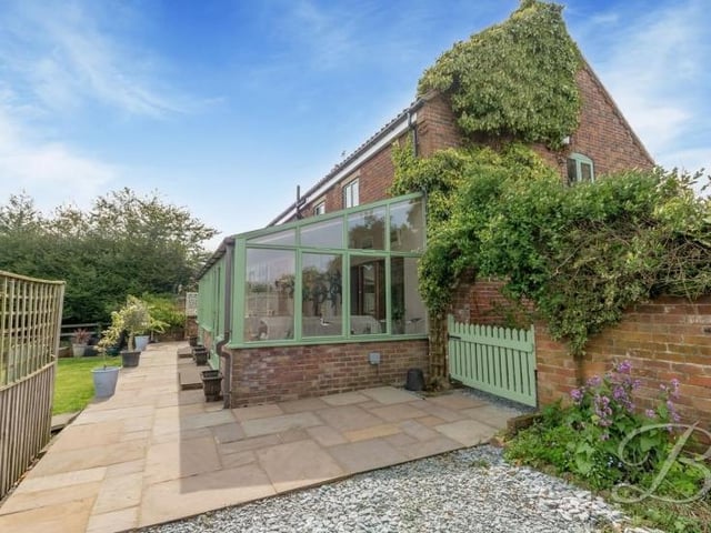 This patio area forms part of the back garden at the Derby Road house.