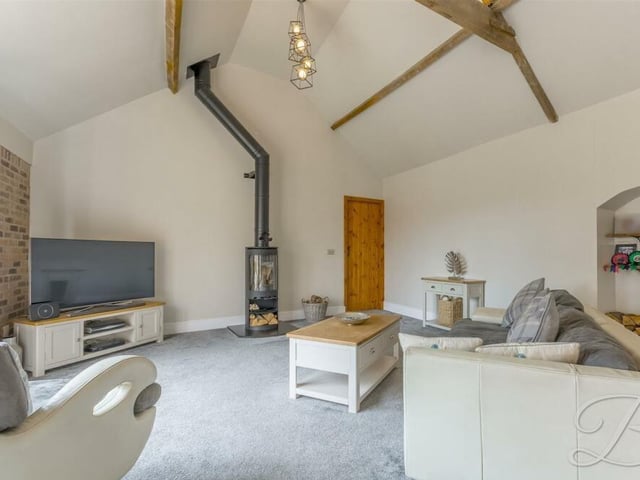 A spectacular log-burner is a highlight of the living room, helping to create a traditional and warm feeling.
