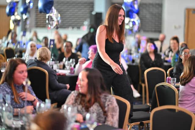 Faye walks up to collect her award