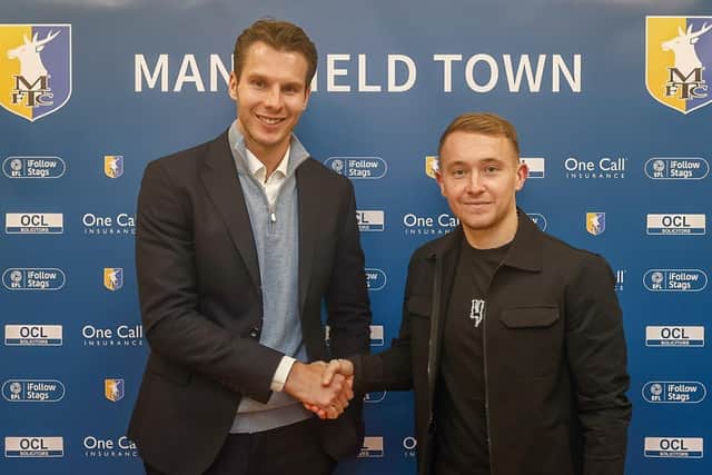 Mansfield Town CEO David Sharpe welcomes new signing Louis Reed.