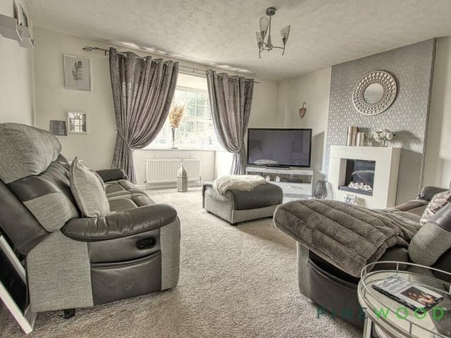 The first of two versatile reception rooms on the ground floor is this lovely lounge, which overlooks the rear garden via a fine bay window. It is cosy and spacious, and comes with a fitted carpet.