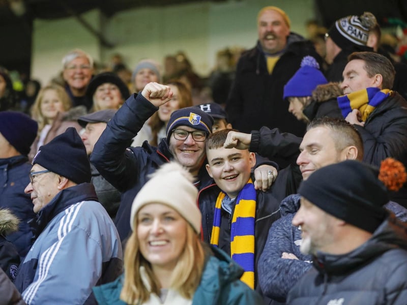 Mansfield Town fans watch the brilliant win at Peterborough United.