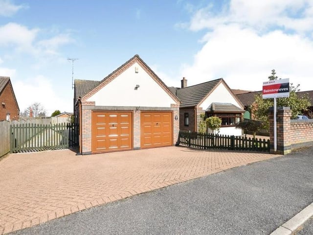 Time to to step outside now, and the first of a handful of photos shows the impressive, brick-built double garage, which sits at the side of the bungalow.